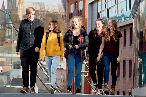 Students walking on a bridge