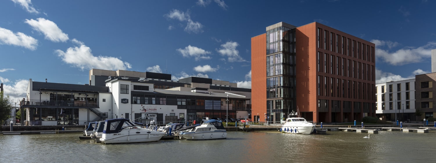 The exterior of Cygnet Wharf from across the Brayford Pool