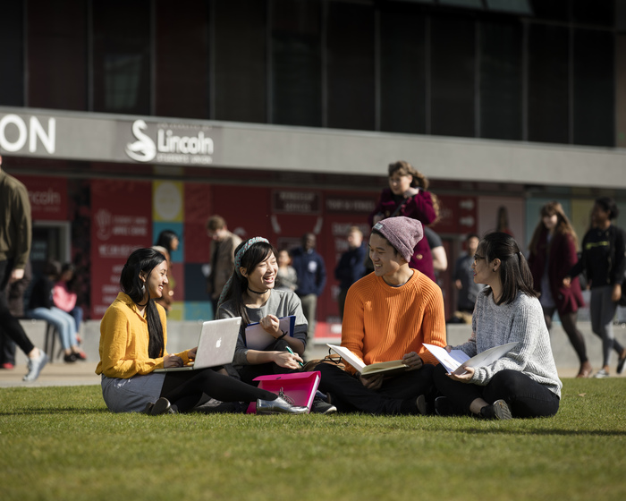 Group of students sitting outside the Students' Union