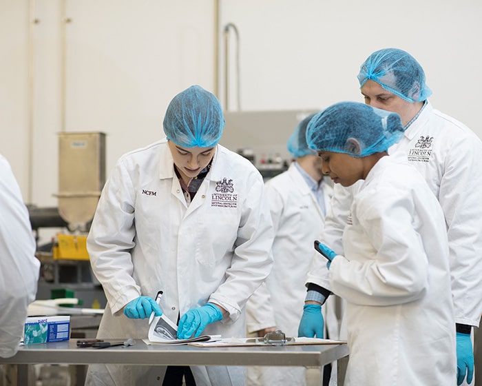 Students at NCFM working in a lab setting