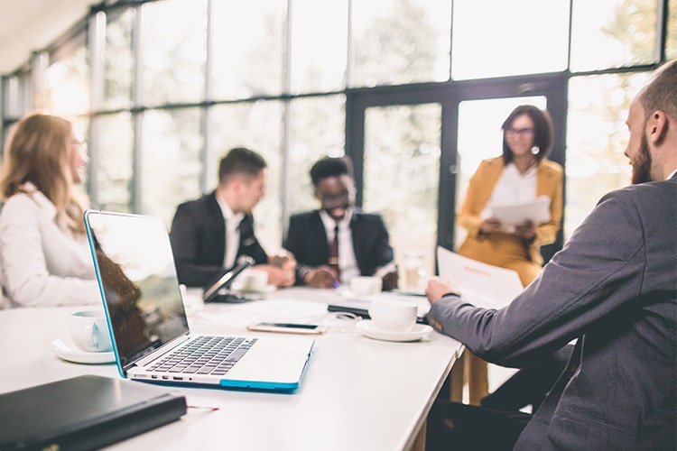 Professional staff meeting around a table