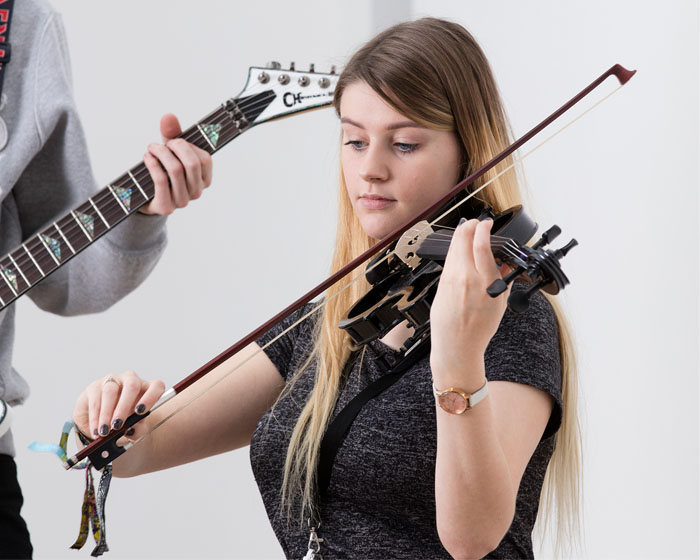 A student playing the violin