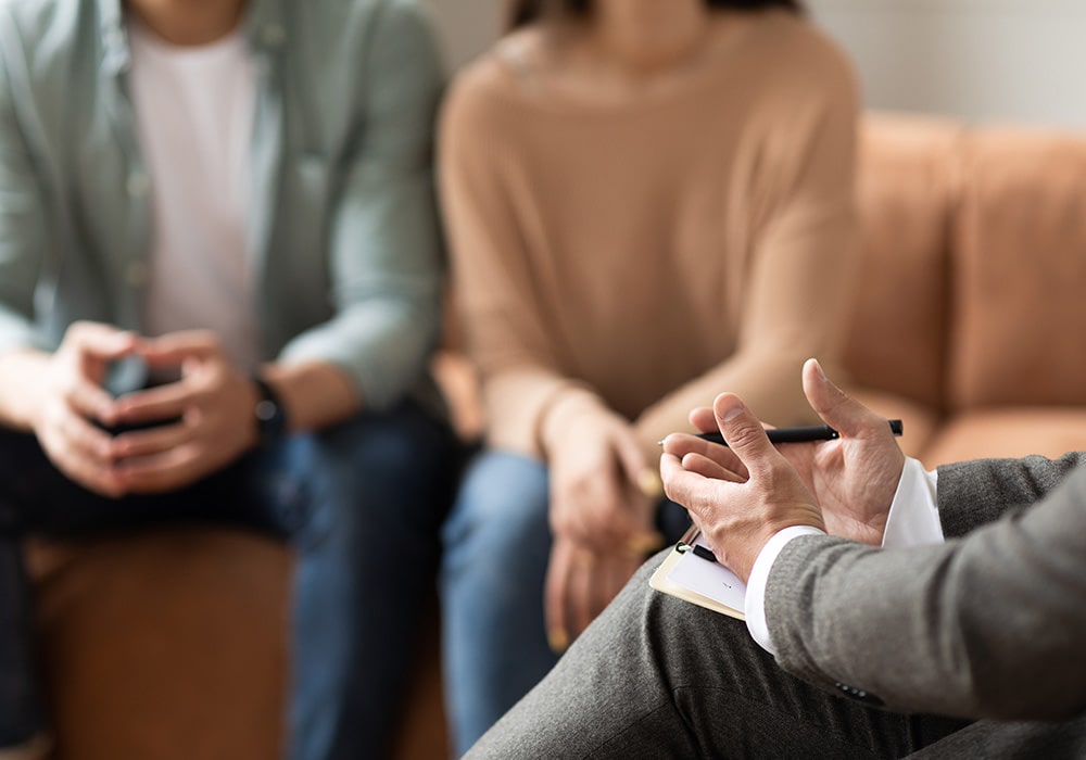 A mediator talking with two parties