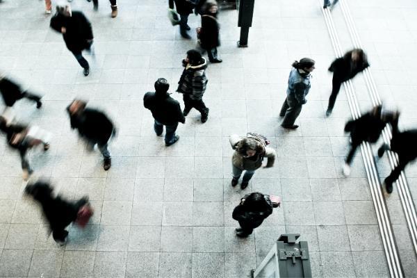 People walking along the pavement