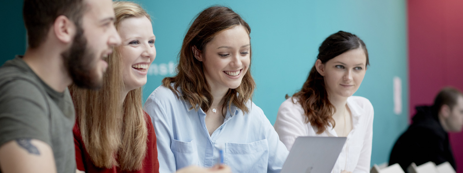 A group of students working together in a seminar room