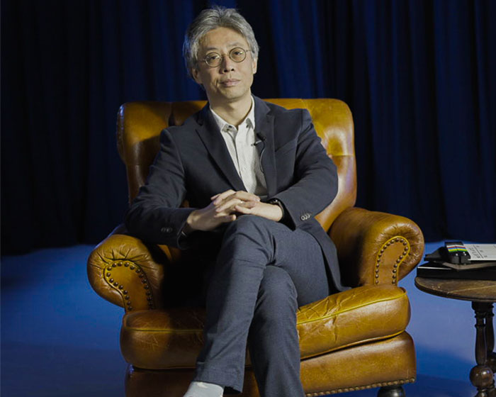 Nicolas Kang-Riou sat in an armchair smiling