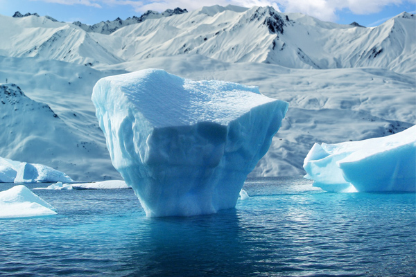 An iceberg floating in water