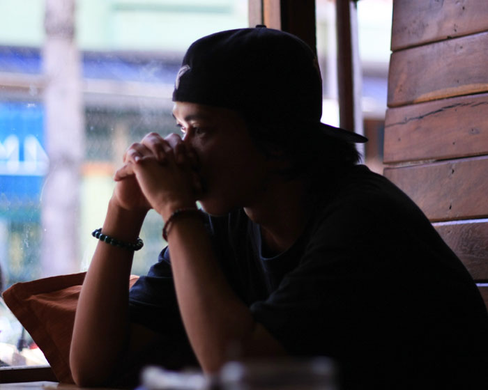 Somebody sitting at a table in a cafe