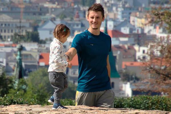 A father walking with his daughter