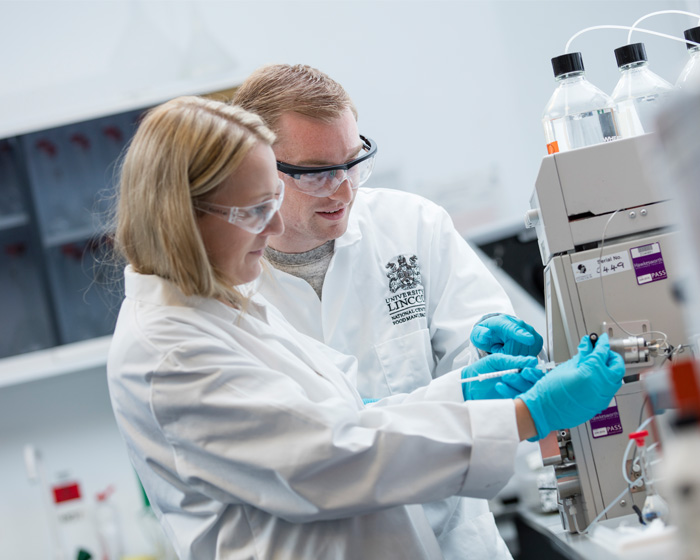 A student working with a food technician