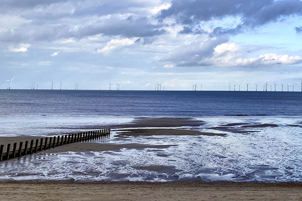 A coastline with wind turbines