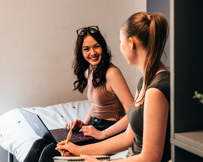 Two students chatting in student accommodation