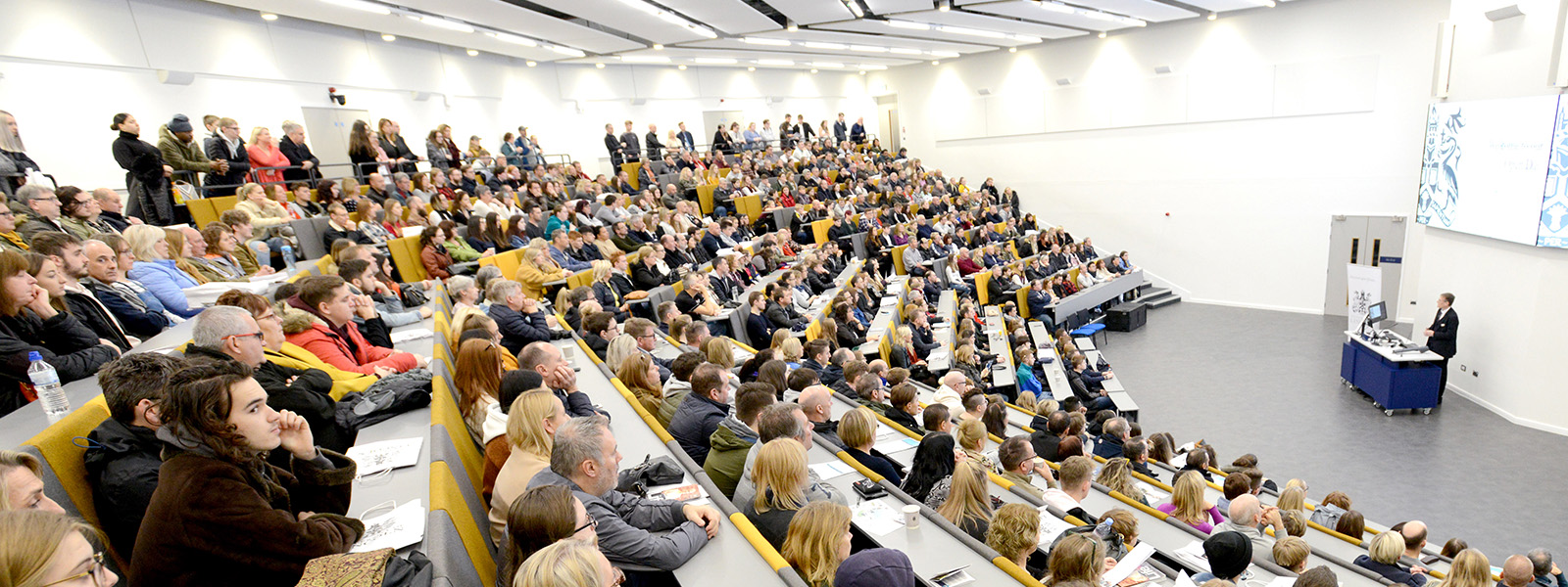 Parents and students watching a talk in a lecture theatre