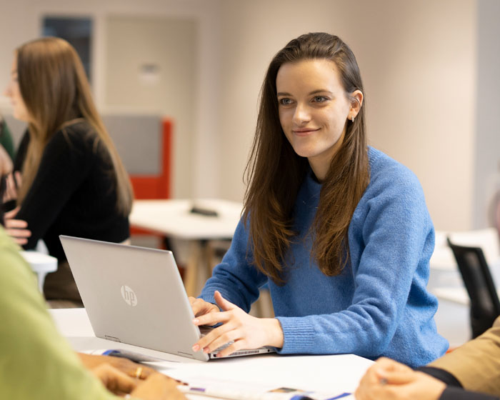 A student working in a seminar room