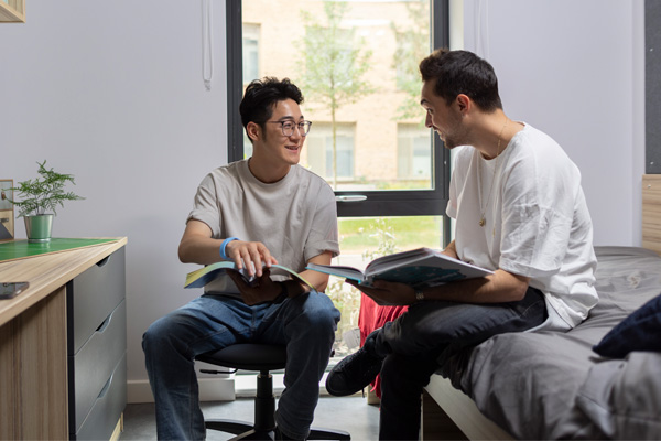 Two students chatting in student accommodation